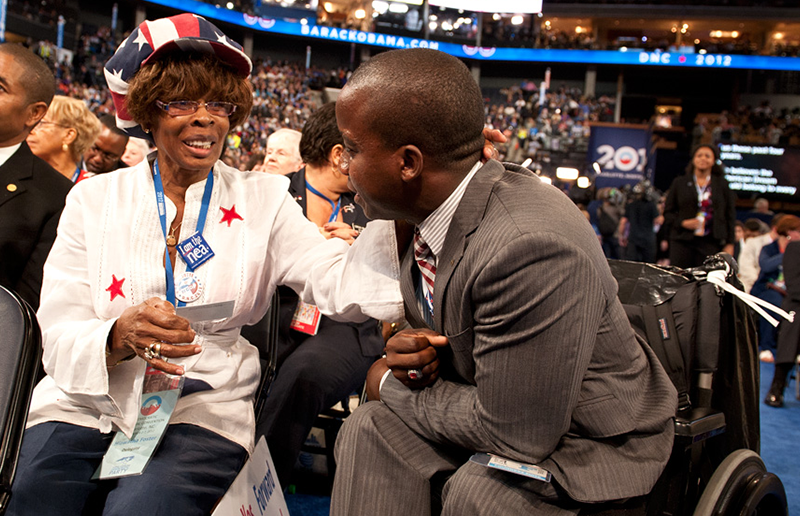 Two people laughing at the Democratic National Convention